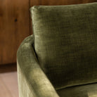 Close-up of the olive green fabric upholstery on the Florence sofa showing the woven texture