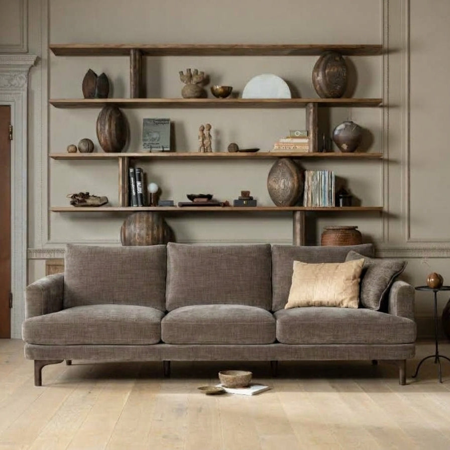 Florence 3-seat sofa in brown fabric styled in a living room against a decorative wall and shelves