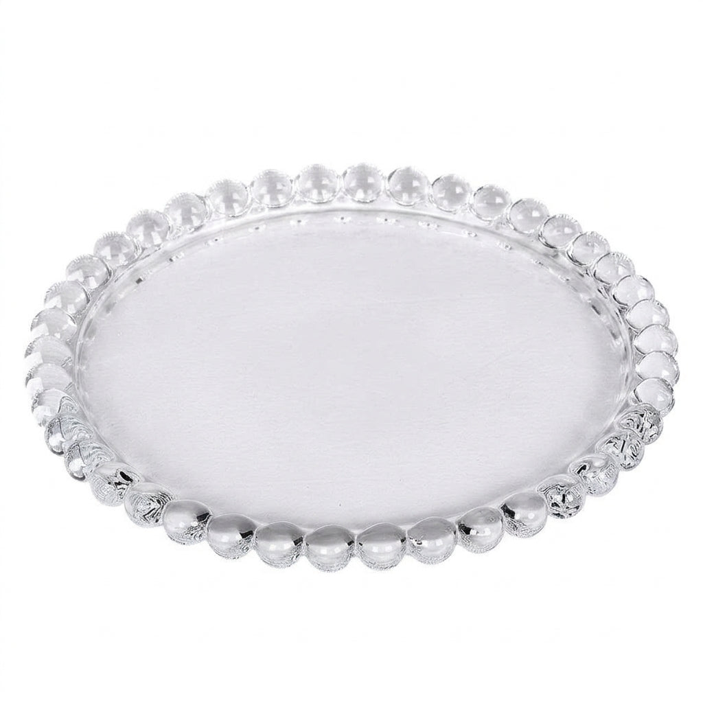 Large clear glass candle plate with a decorative beaded rim on a white background