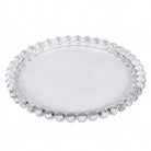 Large clear glass candle plate with a decorative beaded rim on a white background