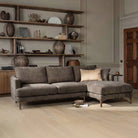 Florence corner sofa in charcoal grey fabric styled with neutral scatter cushions