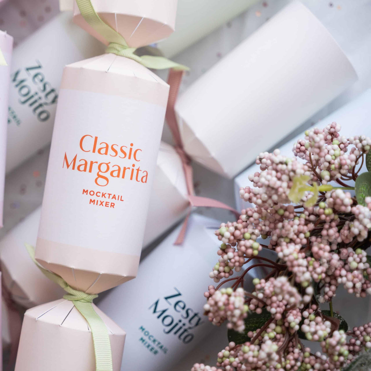 Close-up of a pink Classic Margarita mocktail cracker styled with festive pink berries.