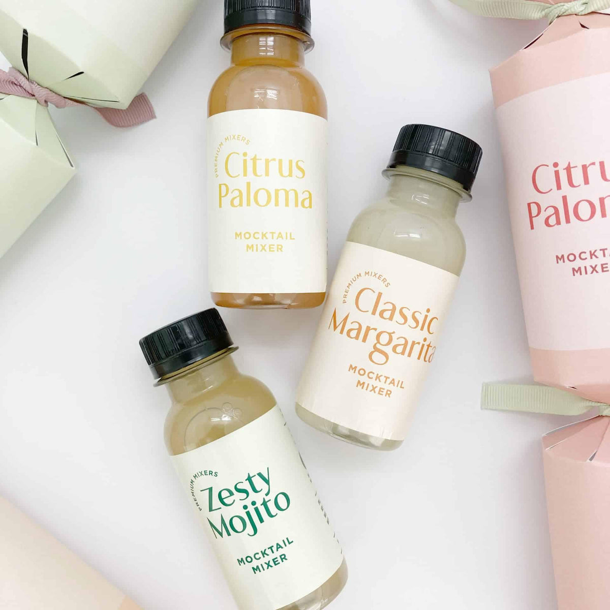 Three 100ml mocktail mixer bottles: Citrus Paloma, Classic Margarita, and Zesty Mojito.