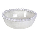 Glossy white resin bowl with a rim of decorative smooth bobbles and a cloudy marble-like finish