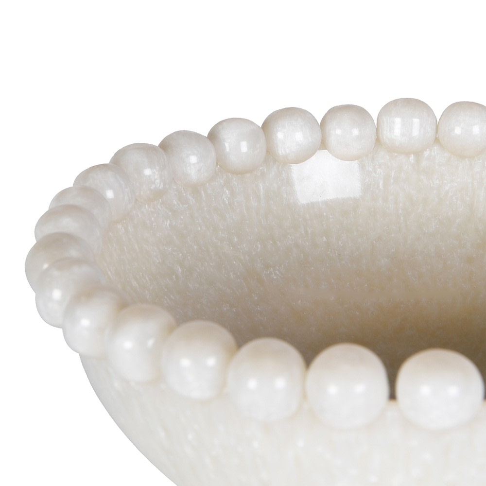 Close-up of the lustrous pearlescent glaze and bobble-textured rim on a shallow bowl.