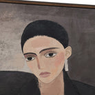 Close-up of the Clara Woman Canvas showing the textured print detail and the slim profile wooden frame