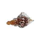Handmade glass conch shell ornament with brown and white internal swirls against a white background