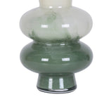 Close-up of the deep green glass base and textured colour transition on the cream vase