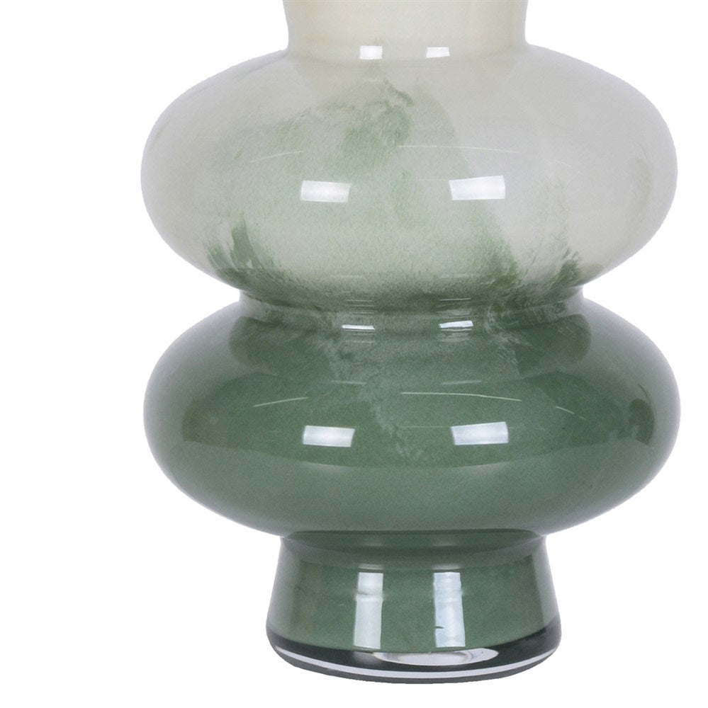 Close-up of the deep green glass base and textured colour transition on the cream vase