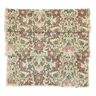 Jenny Wren table runner showing the bird and floral print in brown and green tones on a cream slub fabric.