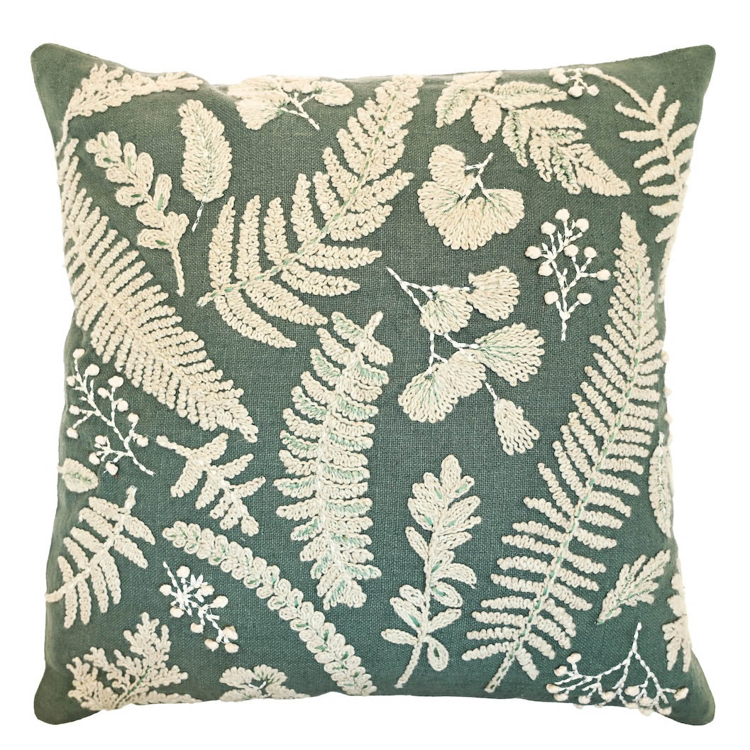 Square eucalyptus green cushion with cream embroidered botanical leaf and fern patterns.