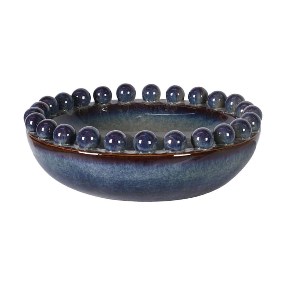 Lazuli ceramic bowl with a multi-toned blue glaze and a distinctive bobble-textured rim, side view.