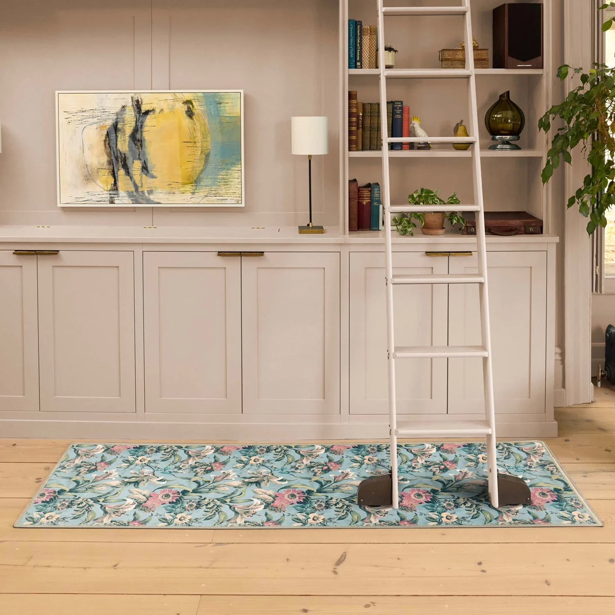 Lys Blue floral runner rug styled in a living room with wooden floors