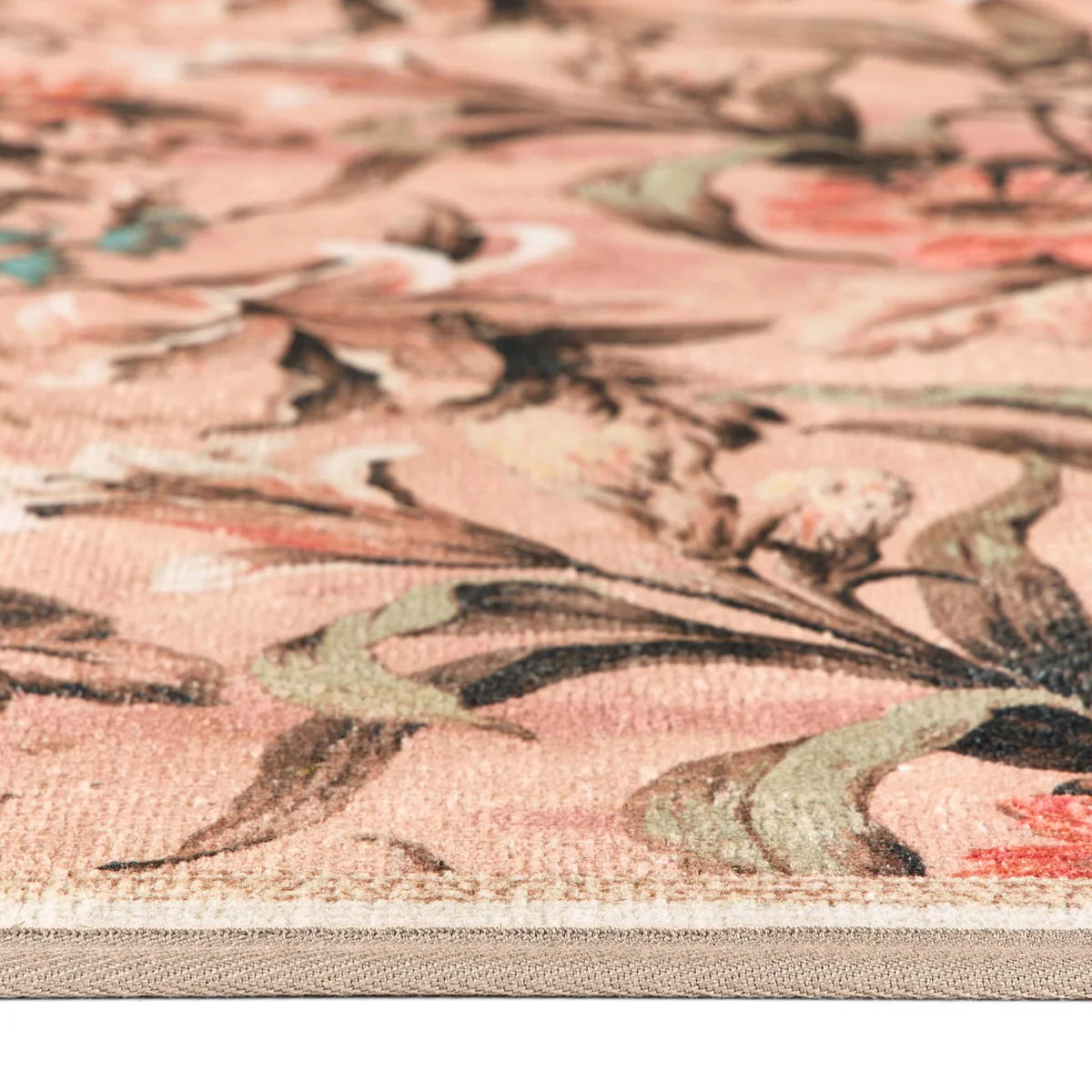 Close-up detail of the painterly floral brushwork and textured rug surface.