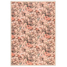 Overhead view of the Lys Pink rug showing a repeating floral pattern on a plaster pink ground.