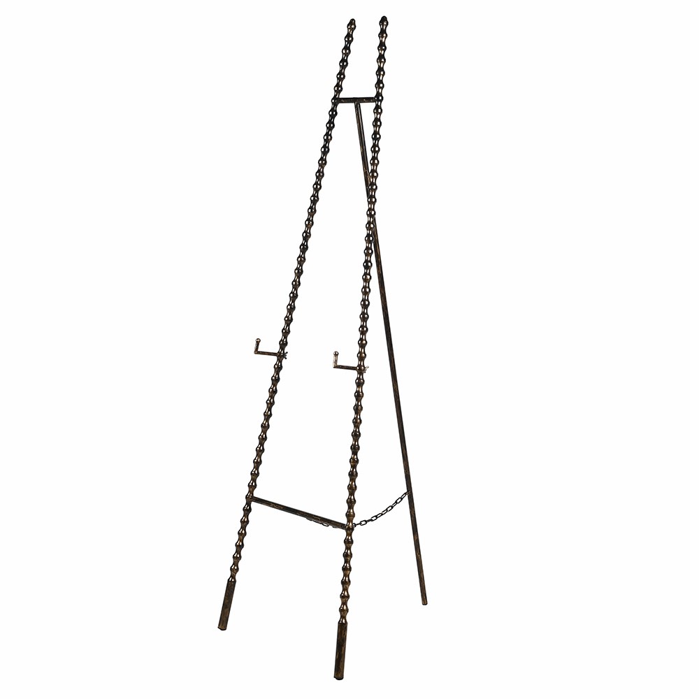 Antique gold metal beaded easel shown at an angle against a white background.