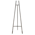 Front-facing view of the tall antique gold metal easel showing the beaded frame.