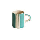 Small espresso mug with hand-painted mint and dark green vertical stripes on a cream background