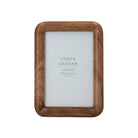 Portrait view of a natural wood photo frame with a smooth rolled edge design and visible wood grain.