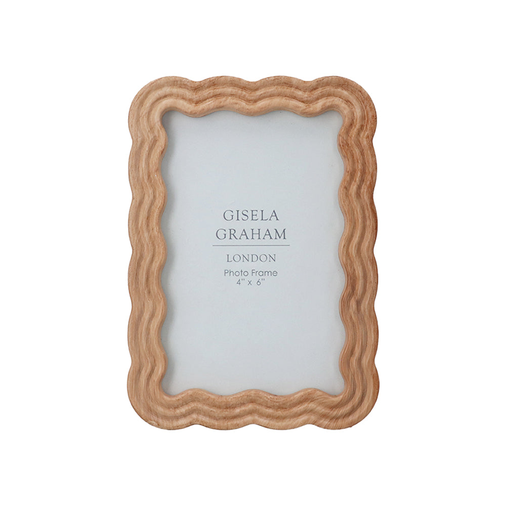Front view of the natural wood wavy photo frame with a warm brown finish and unique undulating border design.