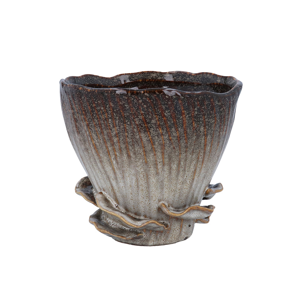 Reactive brown stoneware mushroom pot with sculpted fungus details around the base and a wavy rim