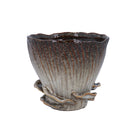 Reactive brown stoneware mushroom pot with sculpted fungus details around the base and a wavy rim