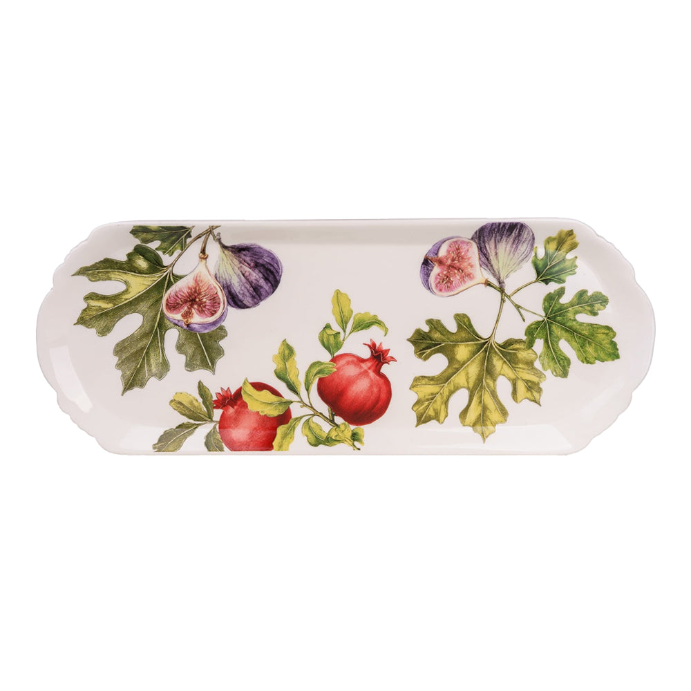 Overhead view of a rectangular white serving platter with botanical fig and pomegranate illustrations and scalloped edges