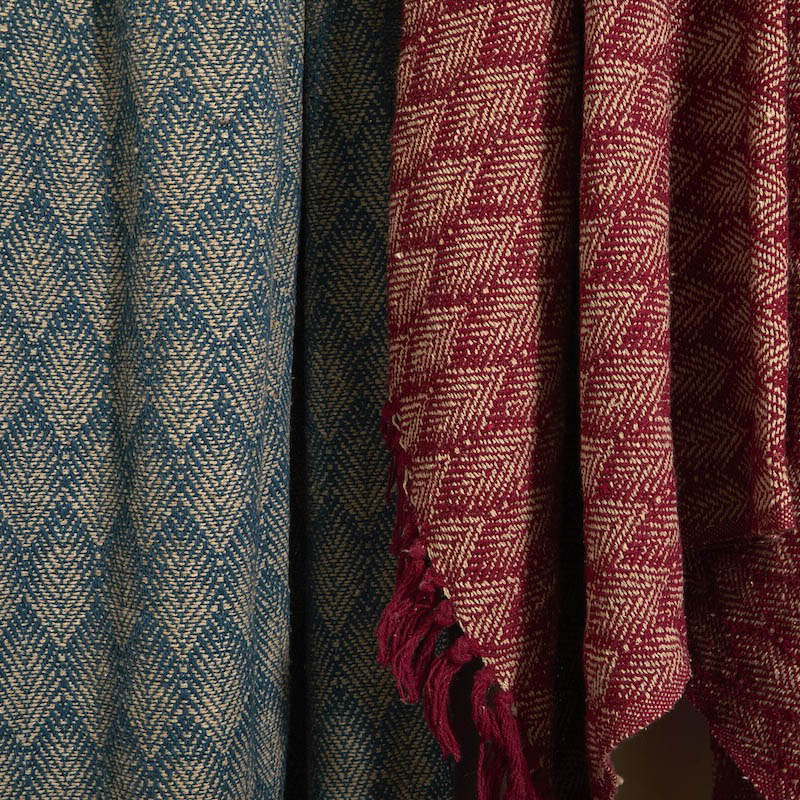 Close-up detail of diamond weave texture on Atlantic Blue and red recycled cotton throws