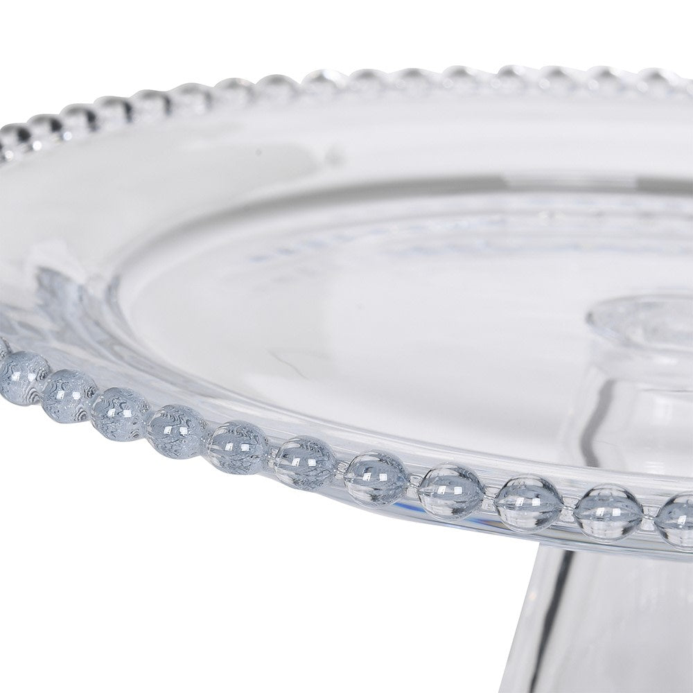 Close-up of the decorative beaded rim on the clear glass cake stand
