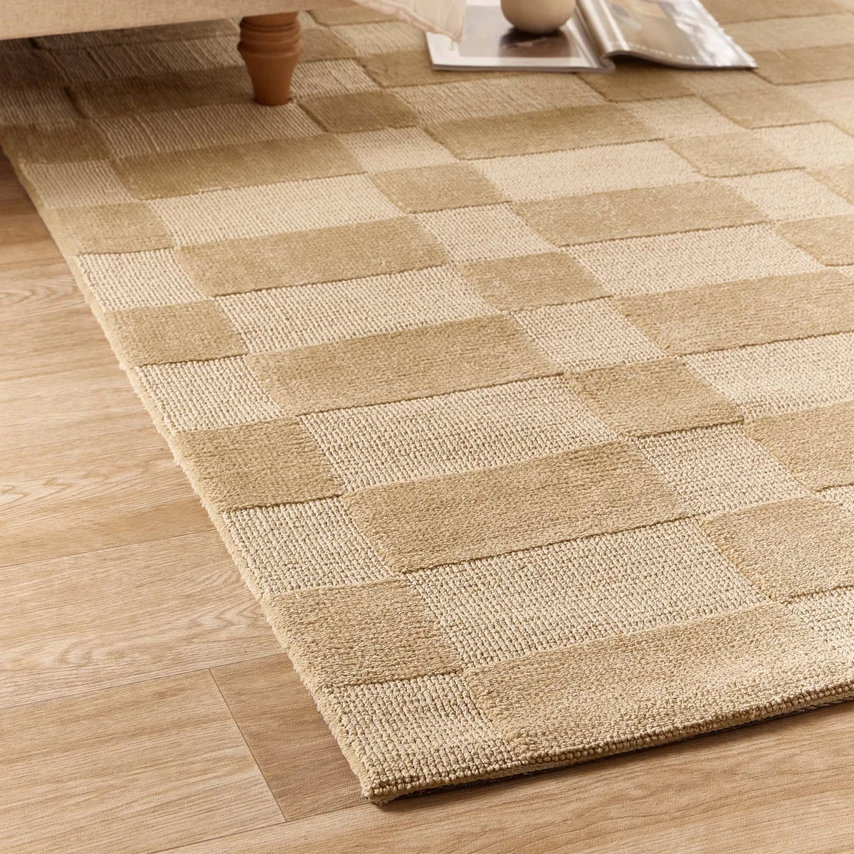 Close-up of the Soho Beige rug showing the high-low textured weave and beige pile detail.