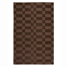 Overhead view of the Soho rug showing the dark brown chocolate offset stripe geometric pattern.