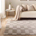 Soho grey mauve rug styled in a light living room under a modern sofa.