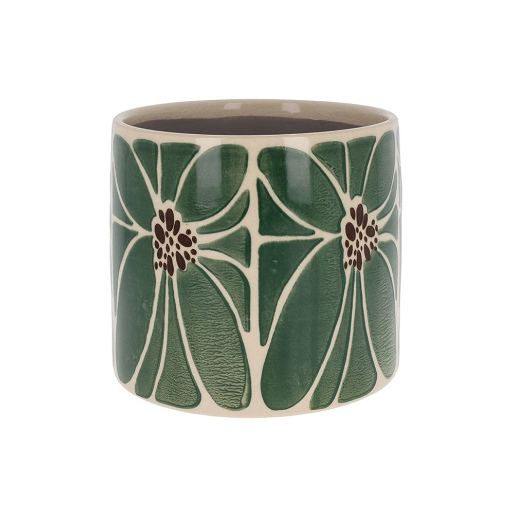 Green ceramic planter with a large white and dark brown petal pattern and a smooth glazed finish