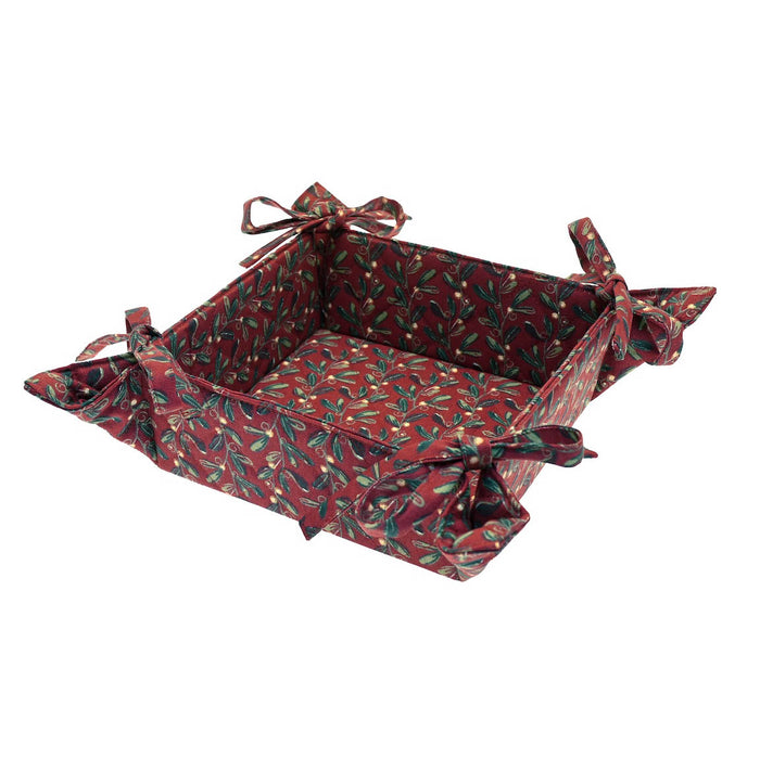 Red cotton bread basket with mistletoe print and bow-tied corners