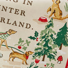 Close-up of the Winter Walkies tea towel showing the detailed dog and snow-dusted tree watercolour artwork.