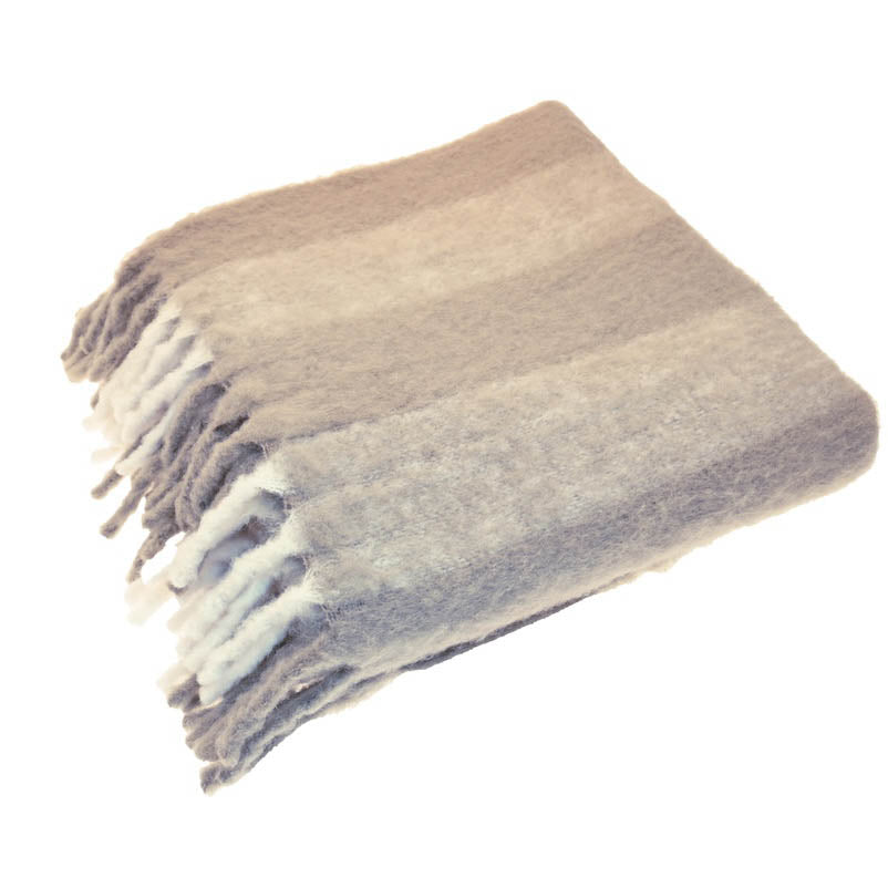 Folded birch coloured wool blend throw with wide stripes and white lambs tail fringing