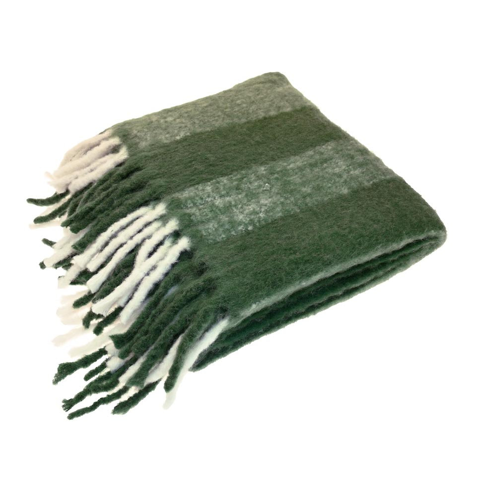 Neatly folded wool blend throw in fern green with wide stripes and lambs tail fringing