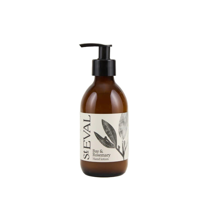 Amber glass bottle of Bay and Rosemary hand lotion with a black pump dispenser and botanical leaf illustration