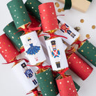 Arrangement of red and green Christmas crackers featuring Nutcracker characters and red ribbon bows.