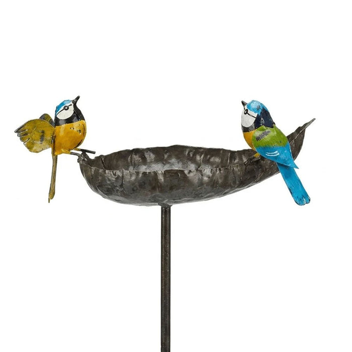 Hand-sculpted recycled metal bird feeder bowl with two painted blue tits perched on the rim