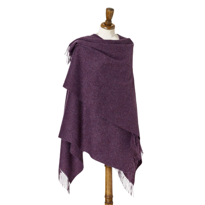 Draped purple Merino lambswool ruana with fringed edges on a tailor's dummy