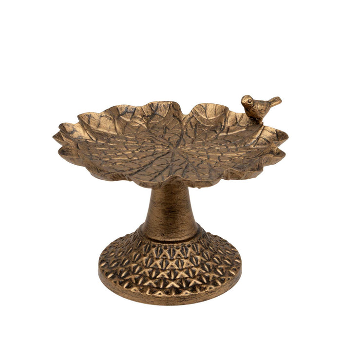 Bruni Bird Dish in tarnished gold metal, featuring a leaf-textured basin and a small bird ornament on the rim.