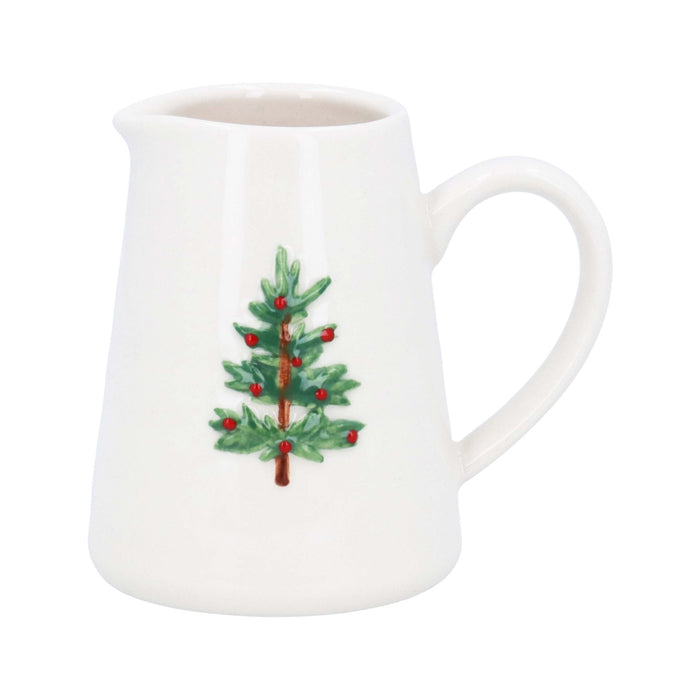 Glossy white stoneware mini jug with a green and red Christmas tree motif and a sturdy handle.