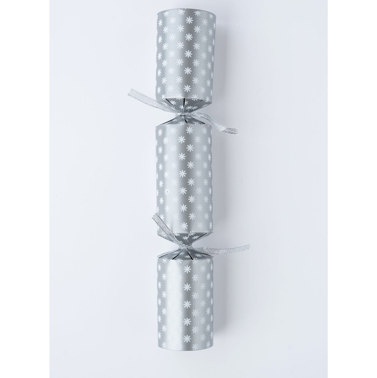 Single silver Christmas cracker with white snowflake print and silver ribbon ties
