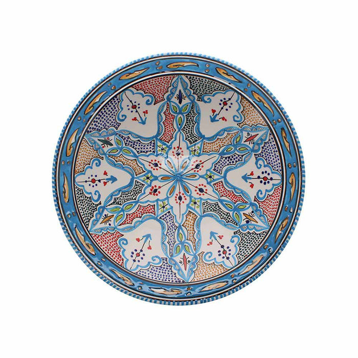 Top-down view of the extra large aquamarine serving bowl showing intricate blue, red, and yellow geometric patterns.