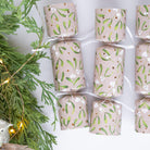 Petite crackers styled next to a lit Christmas tree