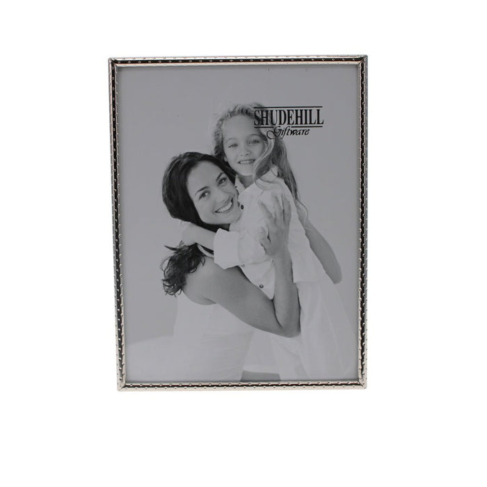 Front view of the silver Fine Edge Photo Frame with textured detailing and a black and white portrait.