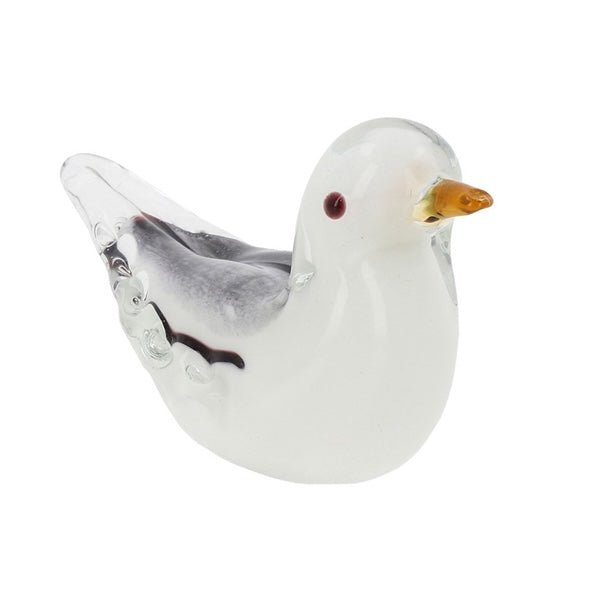 Handmade glass seagull ornament with white translucent body and amber beak on a plain white background