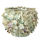 Front view of the large floral decorative pot showing the detailed sculpted ceramic flower patterns.