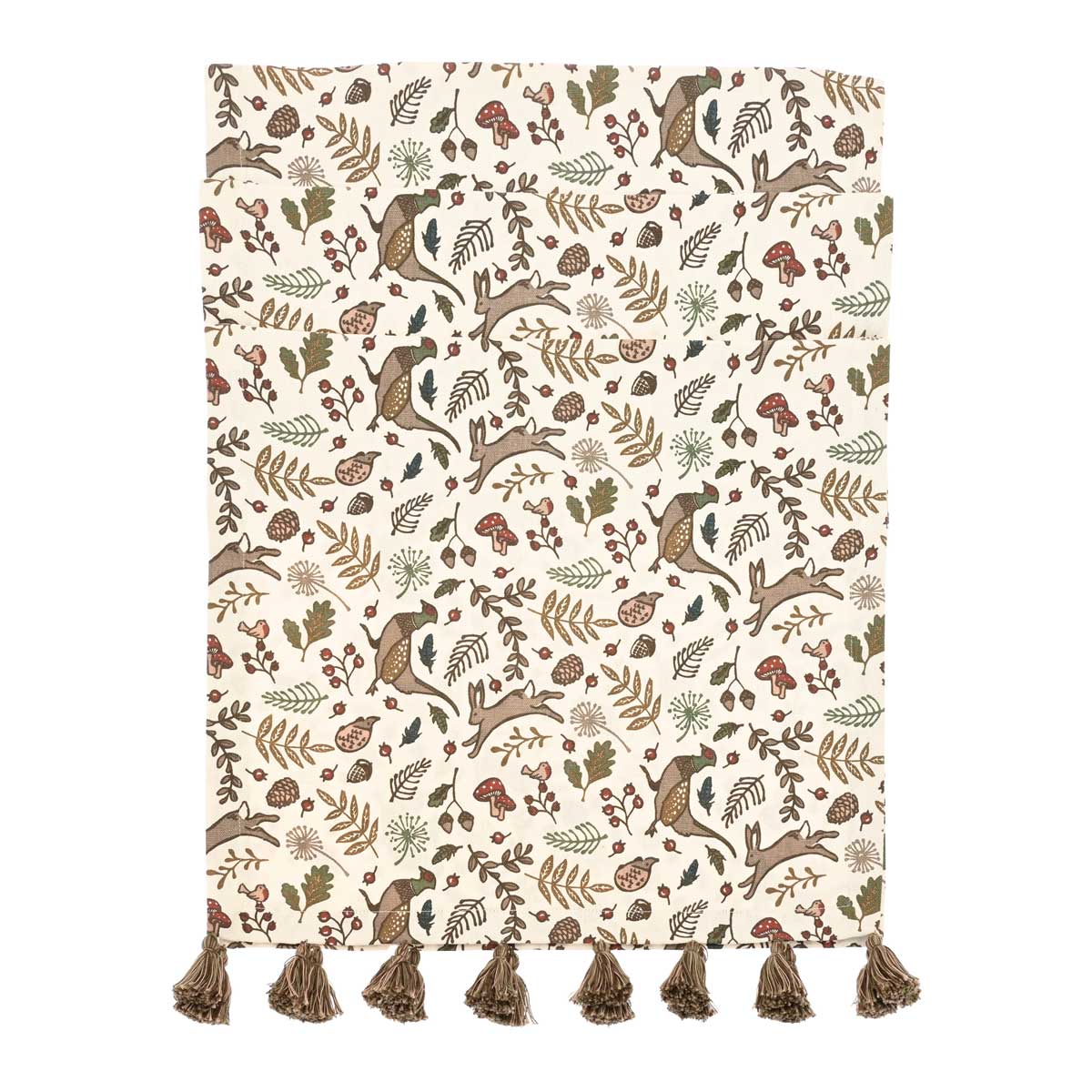 Into the Woods table runner featuring woodland animal and mushroom print on a cream background with brown tassels.